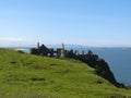 Castle on the hill with the blue sea behind Royalty Free Stock Photo