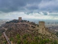Aerial view of Lorca medieval castle with Tour de Alfonz, square towers , covering the entire long plateau of the hill Royalty Free Stock Photo