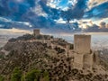Aerial view of Lorca medieval castle with Tour de Alfonz, square towers , covering the entire long plateau of the hill Royalty Free Stock Photo