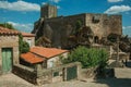 Castle and old houses encircling square with pillory Royalty Free Stock Photo