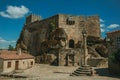 Castle and old houses encircling square with pillory Royalty Free Stock Photo