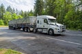 Castle Rock, Washington, USA - May 20, 2023: A white Freightliner Cascadia tractor truck and trailer parked at a Rest Stop on I5 Royalty Free Stock Photo
