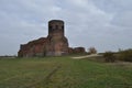 Castle ruins in KoÃâo. Destroyed towers and defensive walls made of red brick on the bank of the Warta River