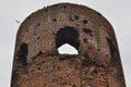 Castle ruins in KoÃâo. Destroyed towers and defensive walls made of red brick on the bank of the Warta River