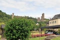 Castle ruins Loewenburg and Philippsburg on a hill spur above Eifel village of Monreal, Germany Royalty Free Stock Photo