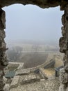 Castle ruins in Rabsztyn in Poland in foggy weather.