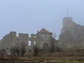 Castle ruins in Rabsztyn in Poland in rainy and foggy weather.