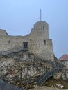 Castle ruins in Rabsztyn in Poland in rainy and foggy weather.