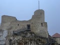 Castle ruins in Rabsztyn in Poland in rainy and foggy weather.