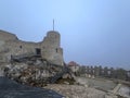 Castle ruins in Rabsztyn in Poland in rainy and foggy weather.