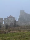 Castle ruins in Rabsztyn in Poland in rainy and foggy weather.