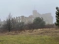 Castle ruins in Rabsztyn in Poland in rainy and foggy weather.