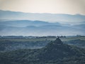 Castle of Salgo in Hungary, fortress on a mountain hill top in a forest, misty morning Royalty Free Stock Photo