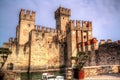 Castle of Scaligers on shore of Lake Garda in resort town of Sirmione, Italy.