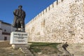 At the castle of Sines with statue in foreground, Portugal