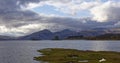 Castle Stalker on its own small Island near to the shore at Loch Linnhe as viewed from the Jubilee Bridge. Royalty Free Stock Photo