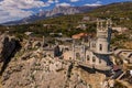 Castle Swallow`s Nest on a rock at Black Sea, Crimea. Castle is located in the urban area of Gaspra, Yalta. Aerial view Royalty Free Stock Photo