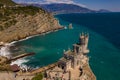 Castle Swallow`s Nest on a rock at Black Sea, Crimea. Castle is located in the urban area of Gaspra, Yalta. Aerial view