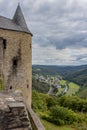 Castle tower, countryside landscape with hills covered with lush green trees, town of de Bourscheid Royalty Free Stock Photo