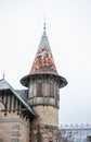 Castle tower with weathered spire shows historic architecture Royalty Free Stock Photo