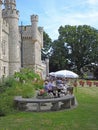 Castle towers cream teas under parasol