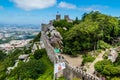 Castle wall is seen perched atop a cliff near the ocean in Corbi, Italy Royalty Free Stock Photo