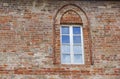 Castle window in a medieval style. Double arched window on a facade of medieval wall. Biforium - ancient window with Royalty Free Stock Photo