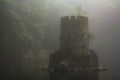 Castled Tower in the middle of lake on foggy day