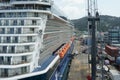 Big passenger cruise ship Celebrity Silhouette moored from starboard side in cargo container terminal in port of Castries. Royalty Free Stock Photo