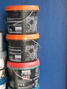 Castrol 7 litre engine oil pail stack together at car service center.