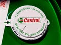 Castrol logo on green engine oil barrel.