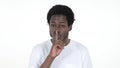 Casual African Man Gesturing Silence, Finger on Lips, White Background Royalty Free Stock Photo