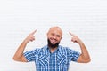 Casual Bald Bearded Business Man Smiling Point Fingers Up Head