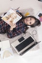 Casual blogger woman reading a magazine in her fashion office. Royalty Free Stock Photo