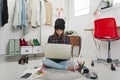 Casual blogger woman working in her fashion office. Royalty Free Stock Photo
