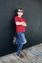 Casual boy leaning against wall Royalty Free Stock Photo
