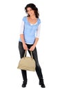 Casual brunette with a handbag Royalty Free Stock Photo