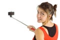 Casual brunette using selfie stick Royalty Free Stock Photo