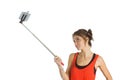 Casual brunette using selfie stick Royalty Free Stock Photo