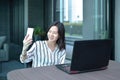 Casual Business Asian Woman taking a selfie with smartphone in f Royalty Free Stock Photo