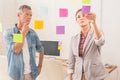 Casual business colleagues reading sticky notes Royalty Free Stock Photo