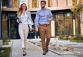 Casual business male and female colleagues going outiside Royalty Free Stock Photo