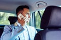 Casual business man talking on cell phone in the car Royalty Free Stock Photo