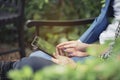 Casual Business man using smart tablet working outdoor in the park instead of office with technology on hands. New generation