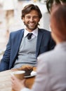 A casual business meeting. A businessman and woman having a meeting over coffee. Royalty Free Stock Photo