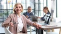 Casual business people around conference table in office Royalty Free Stock Photo