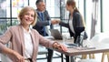 Casual business people around conference table in office Royalty Free Stock Photo