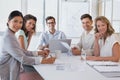 Casual business team having a meeting smiling at camera Royalty Free Stock Photo