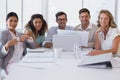 Casual business team having a meeting smiling at camera Royalty Free Stock Photo