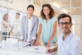 Casual business team having a meeting smiling at camera Royalty Free Stock Photo